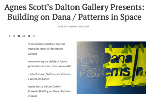 Snapshot from the Smoke Signal News showing the installatin of the title wall for the exhibition "Patterns In Space"